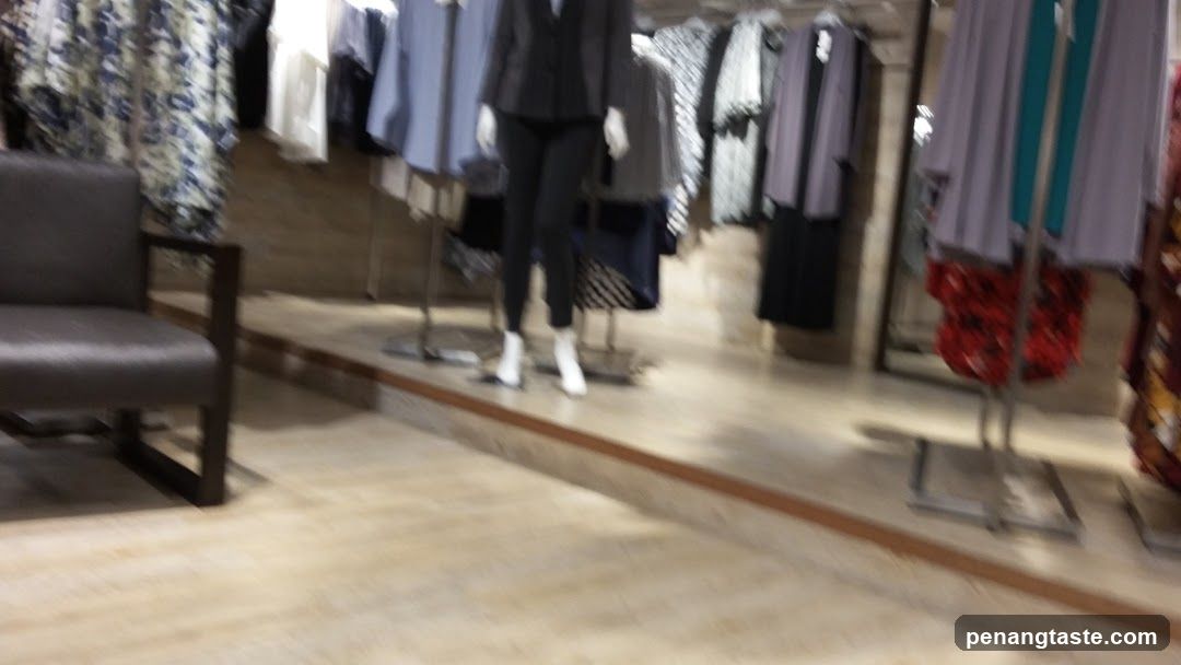 Clothing store interior with mannequins and clothing racks