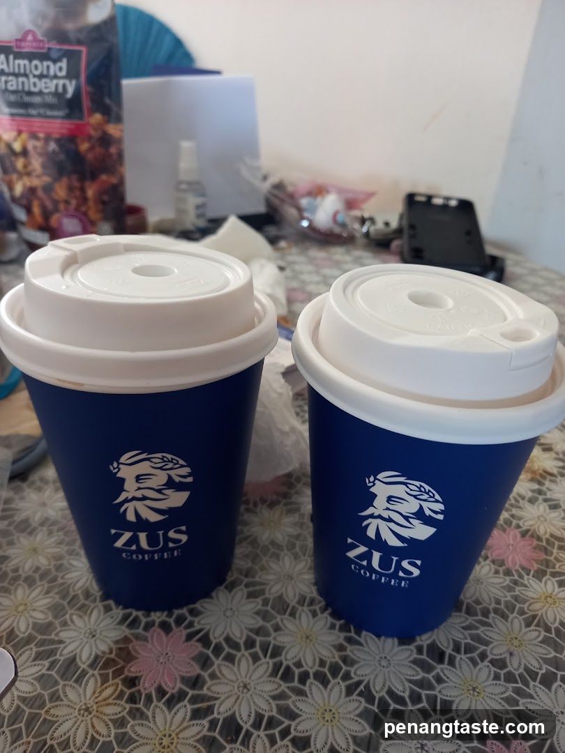 Two ZUS Coffee Cups