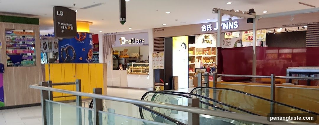 Mall Interior with Shops and Escalators