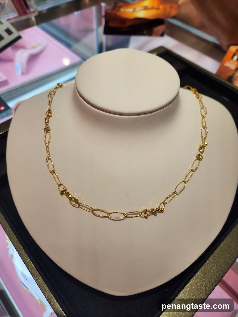 Gold necklace on display