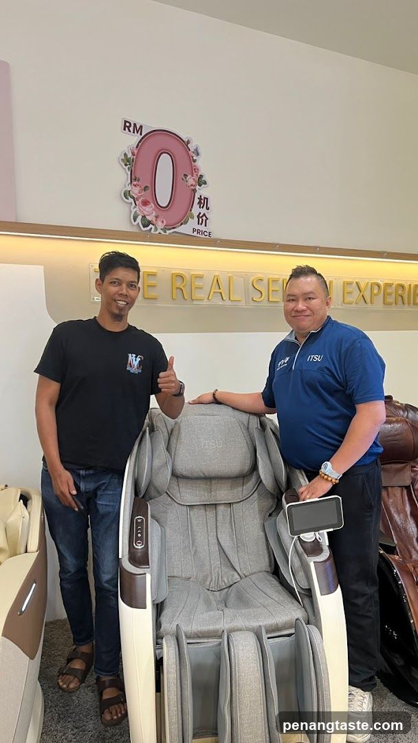 Two men with a massage chair