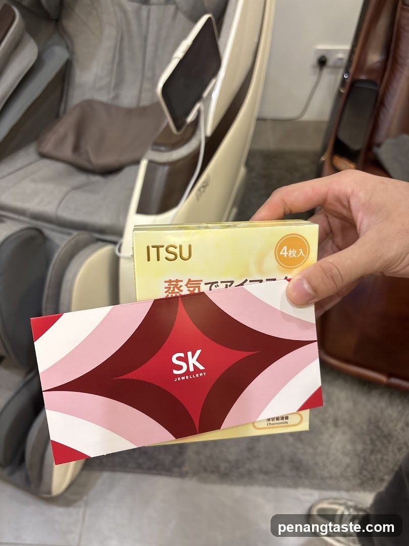Hand holding SK Jewellery card and ITSU product