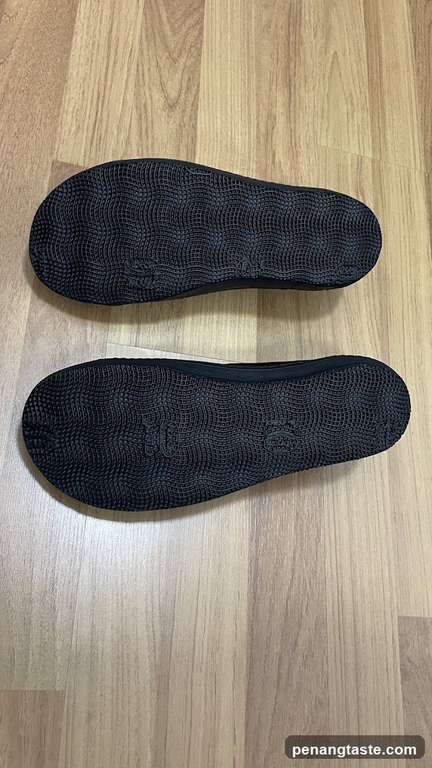 Soles of black flip-flops