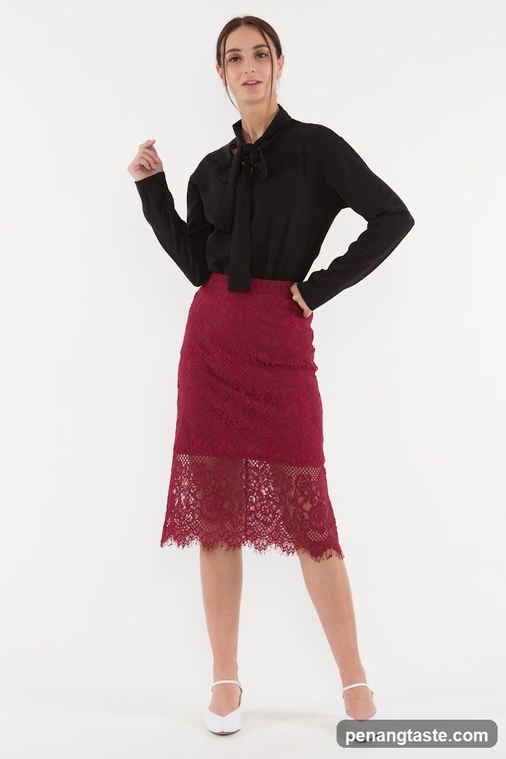 Woman in Black Blouse and Burgundy Lace Skirt