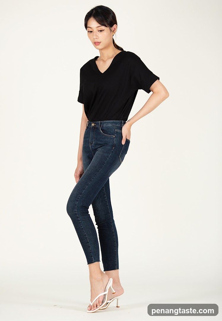 Woman in Black Top and Jeans