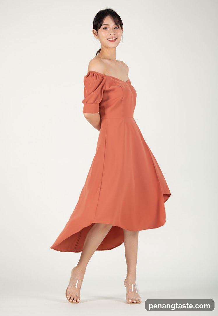 Woman in Orange Off-the-Shoulder Dress