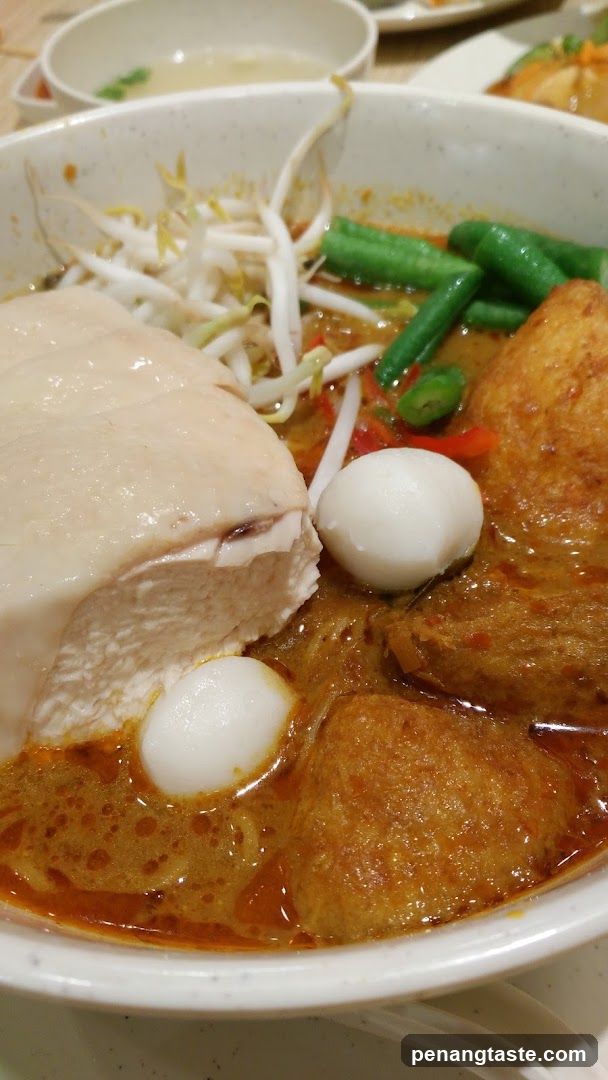 Close-up of a bowl of curry noodles