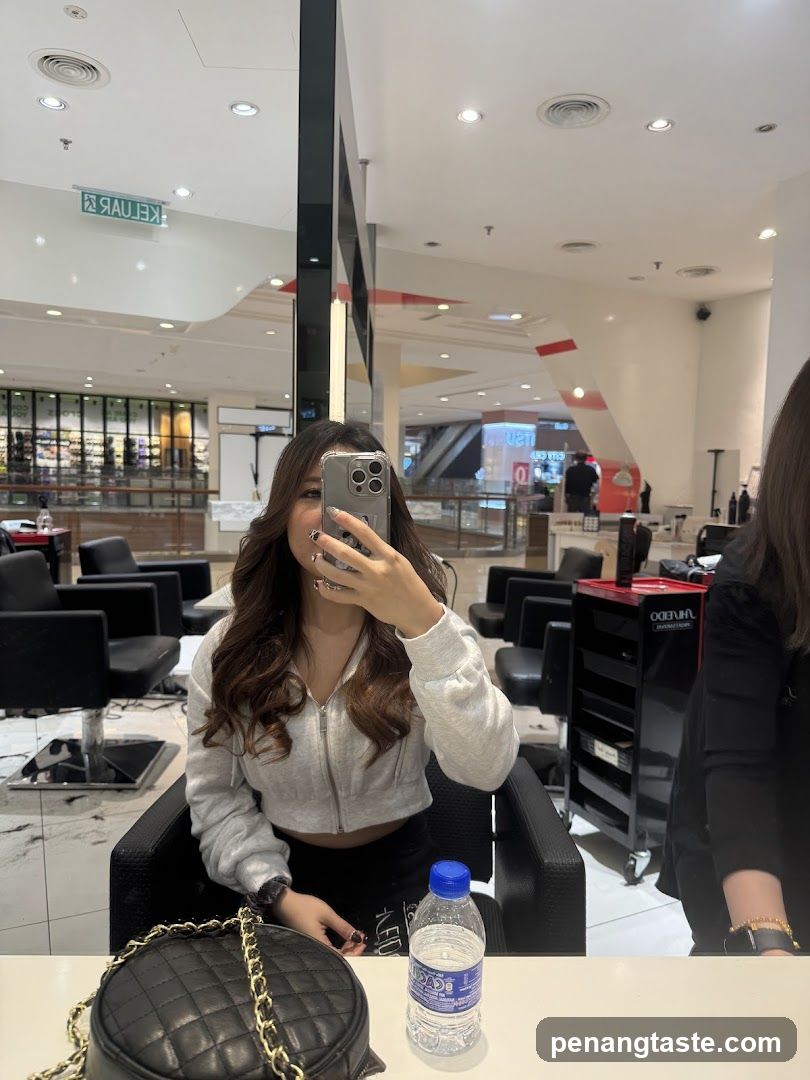 Woman taking a selfie in a salon