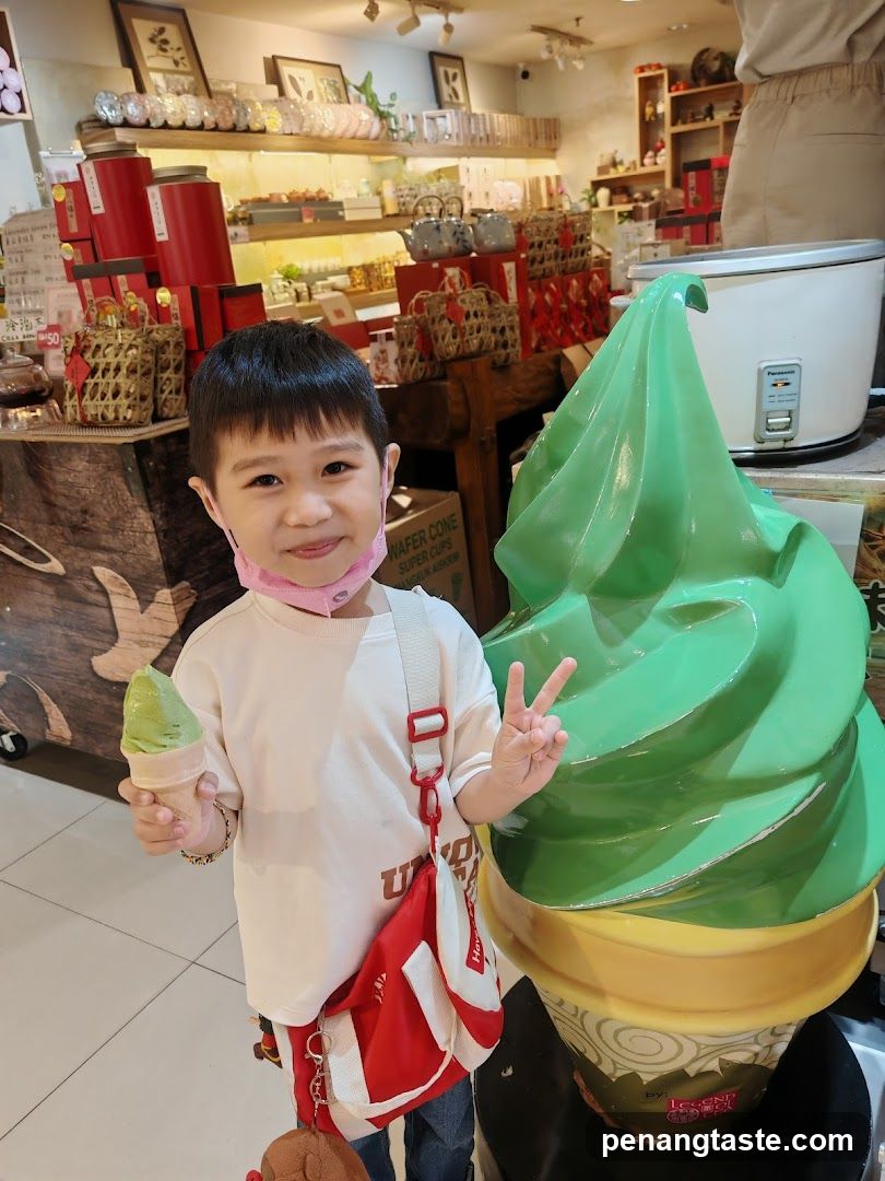 Boy with Ice Cream and Giant Ice Cream Sculpture