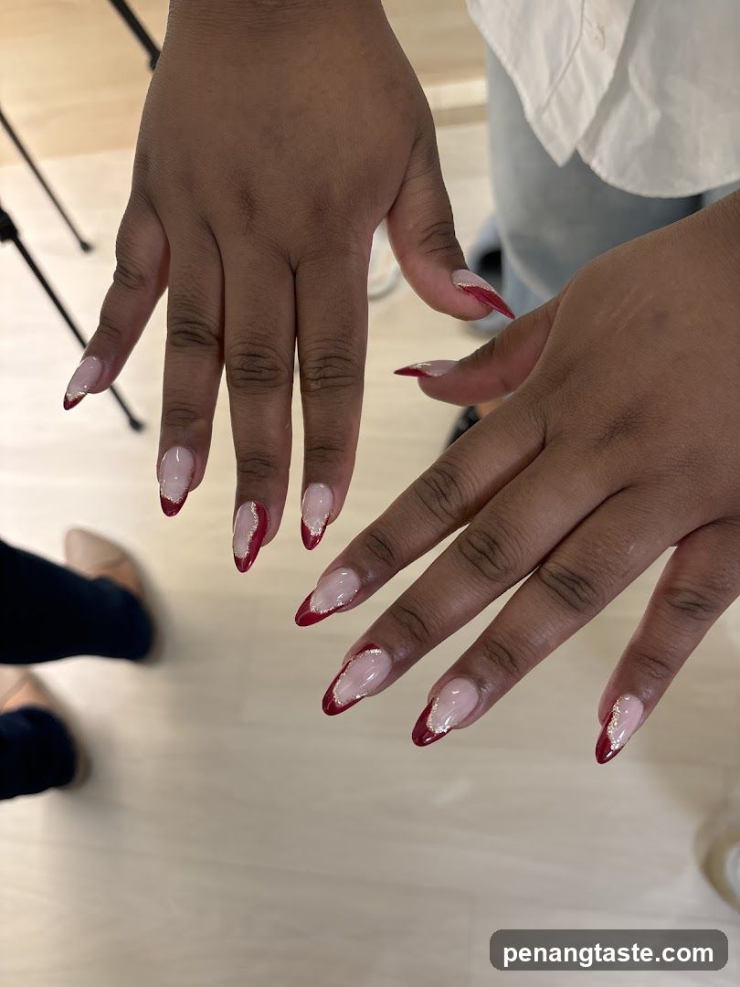French Tip Nails with Red and Glitter Accents