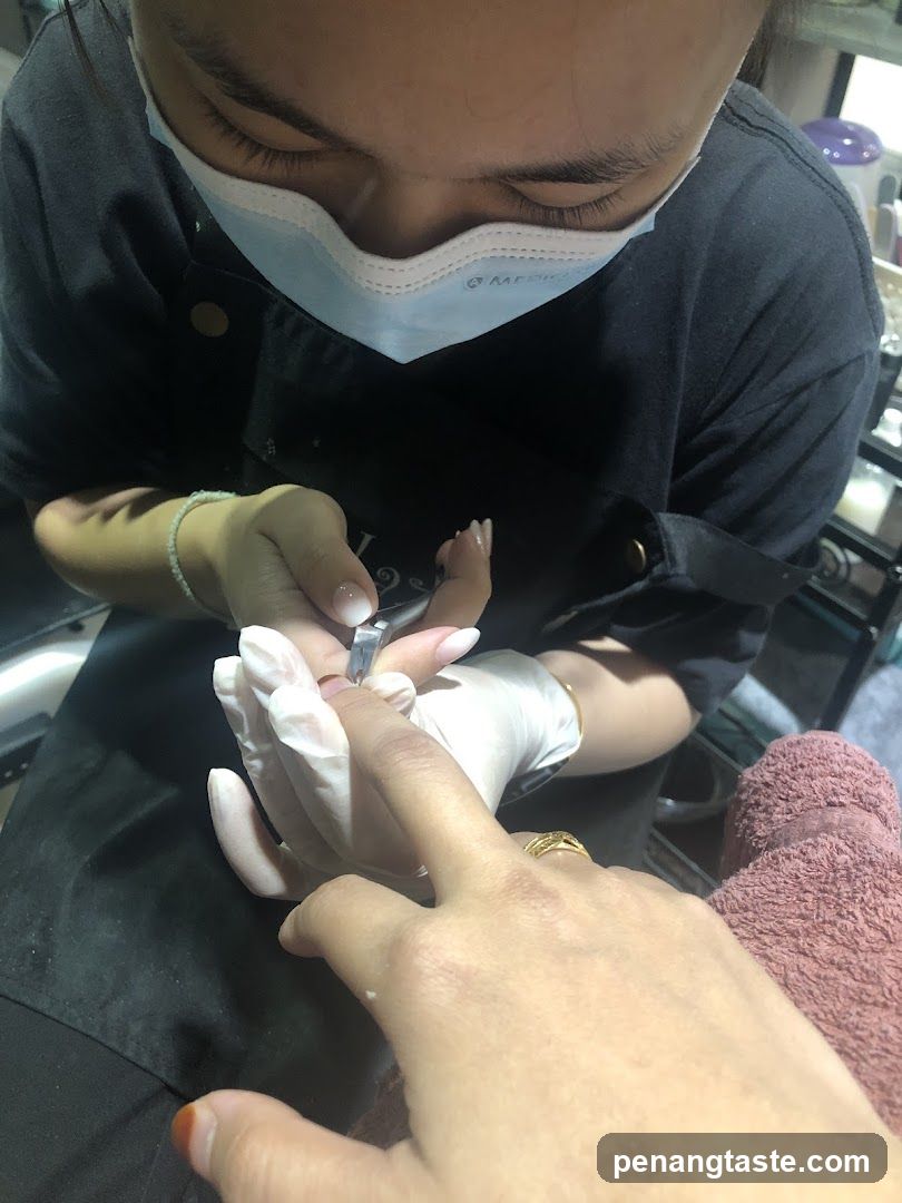 Nail Technician Working on Client's Nails