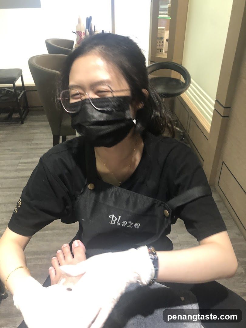 Nail Technician Performing Pedicure