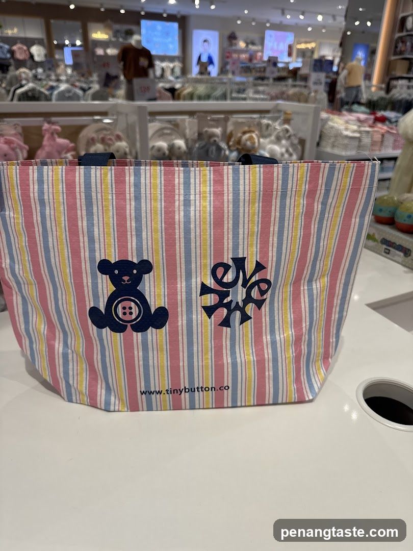 Striped tote bag with bear and logo design
