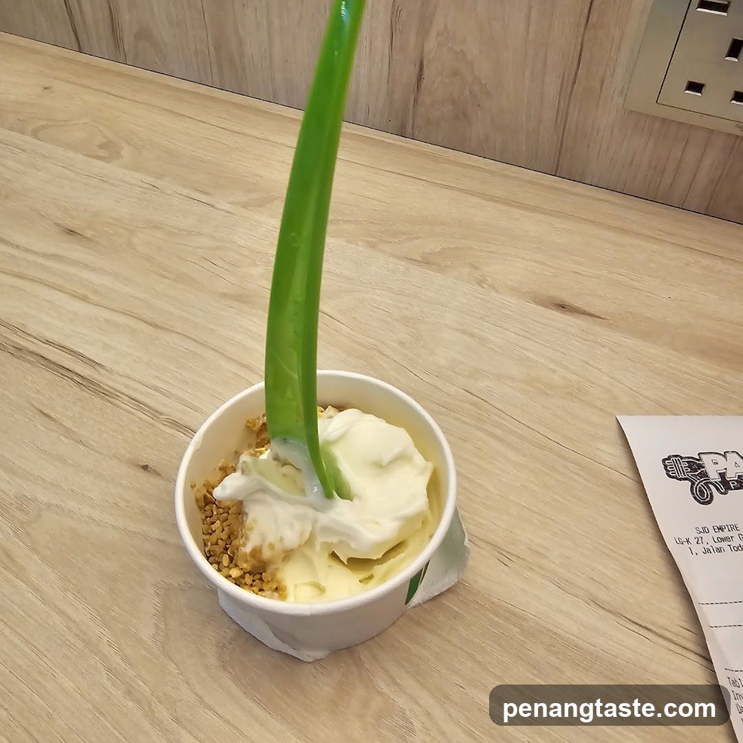 Frozen yogurt cup on wooden table