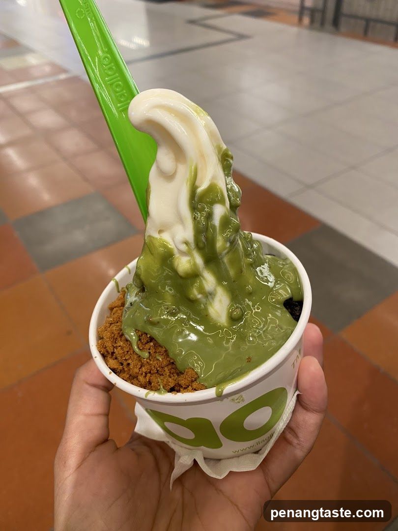 Hand holding frozen yogurt cup