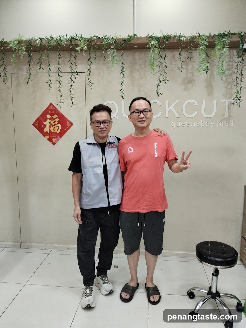 Two men posing in a store interior