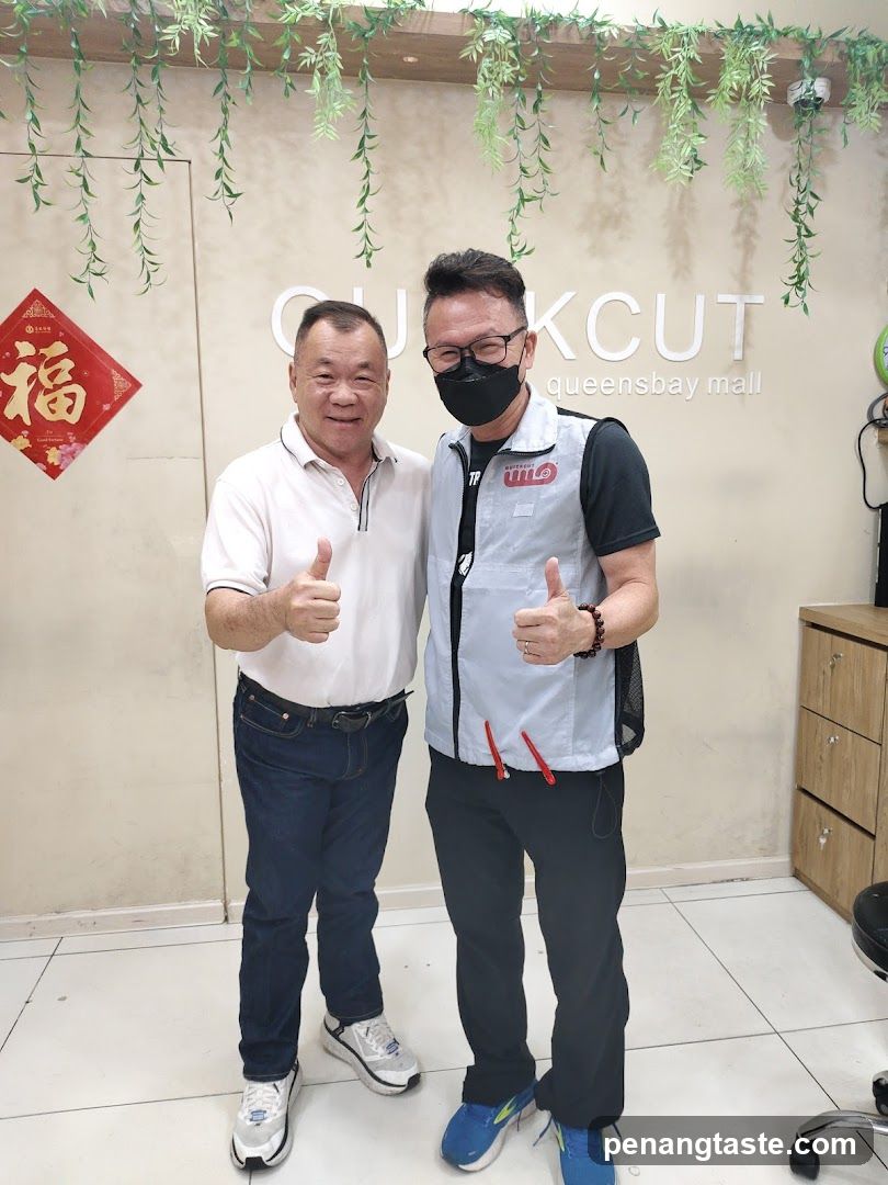 Two men posing inside a store