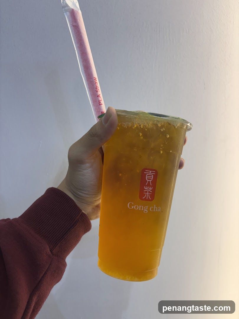 Hand holding Gong cha drink