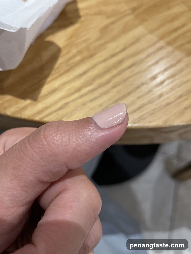 Hand with painted nail