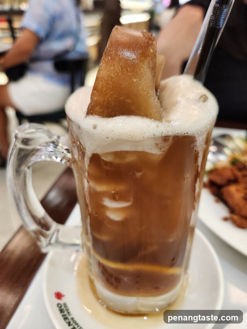 Coffee with ice cube in mug