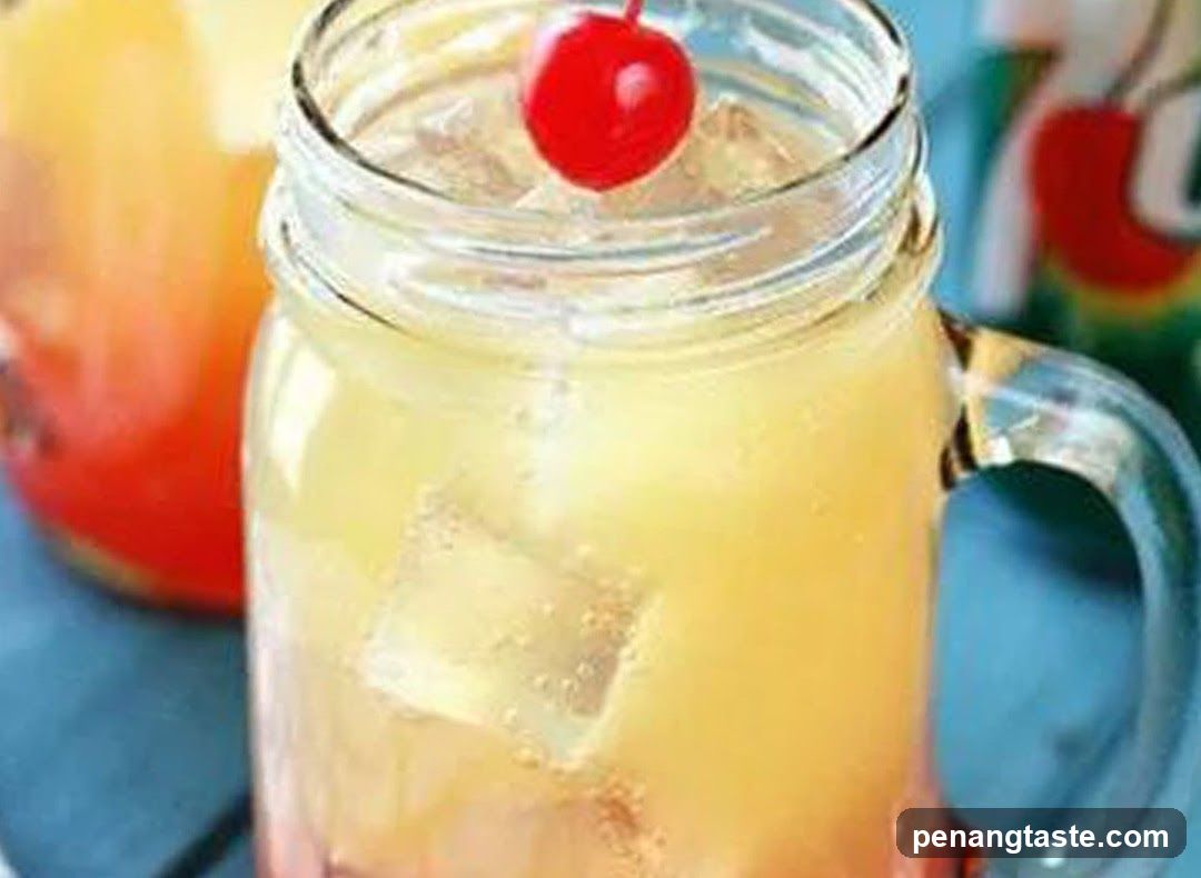 Pineapple Drink with Cherry Garnish