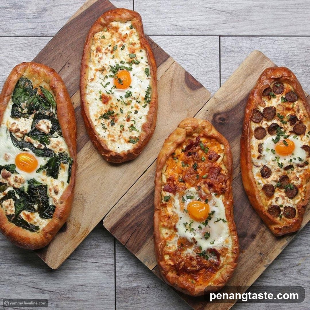 Four variations of khachapuri on wooden boards