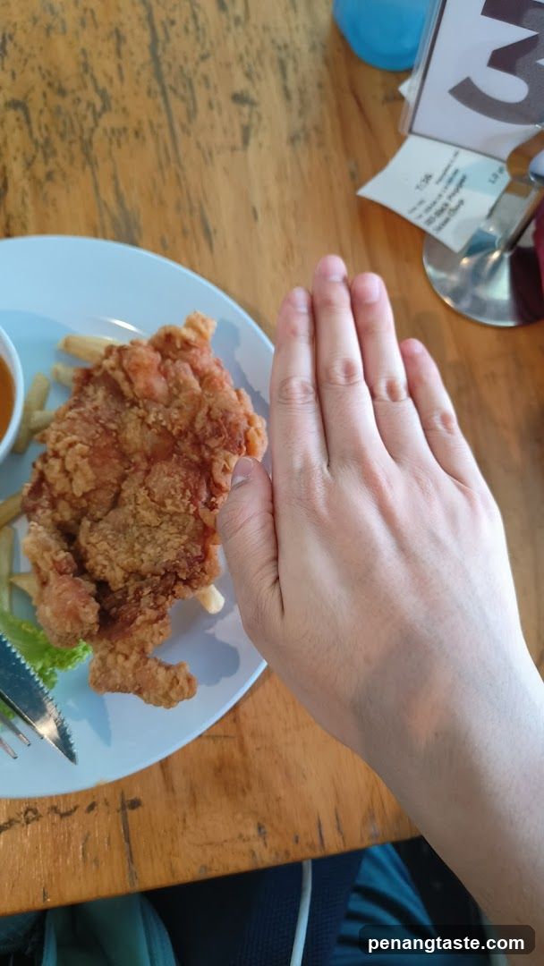 Hand over fried chicken dish