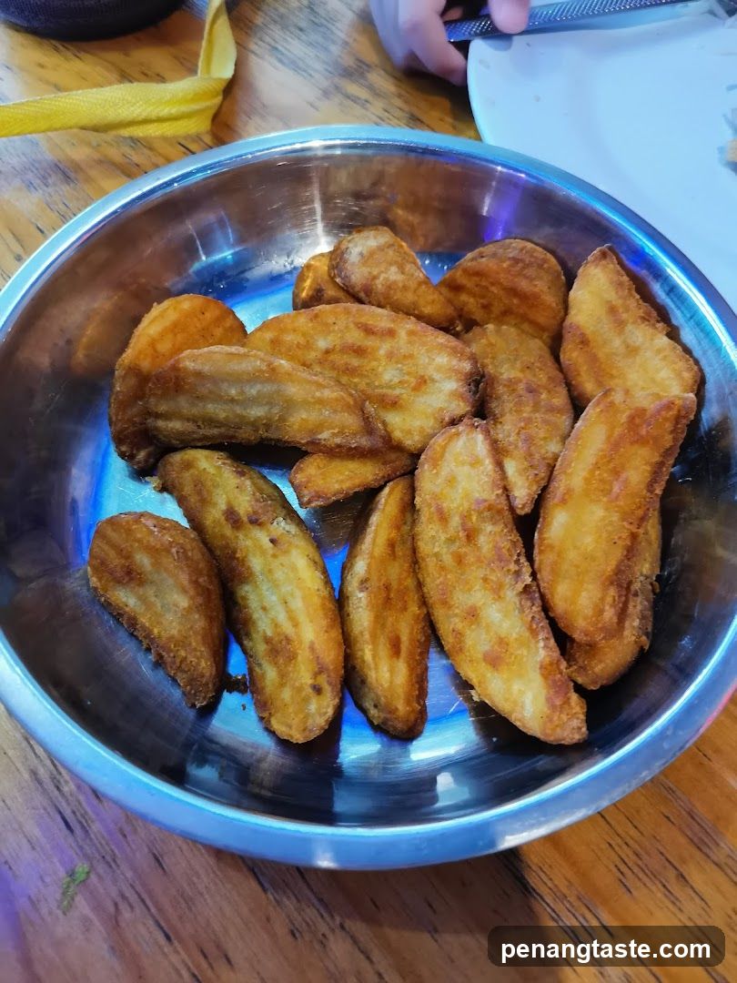 Fried Potatoes in Metal Bowl