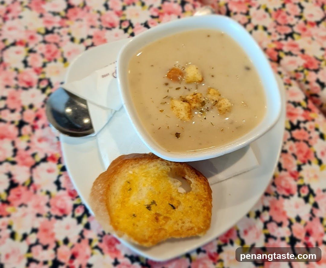 Soup and Bread on Floral Tablecloth