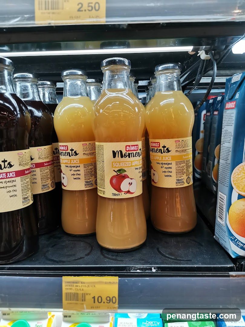 Supermarket Shelf with Apple Juice Bottles
