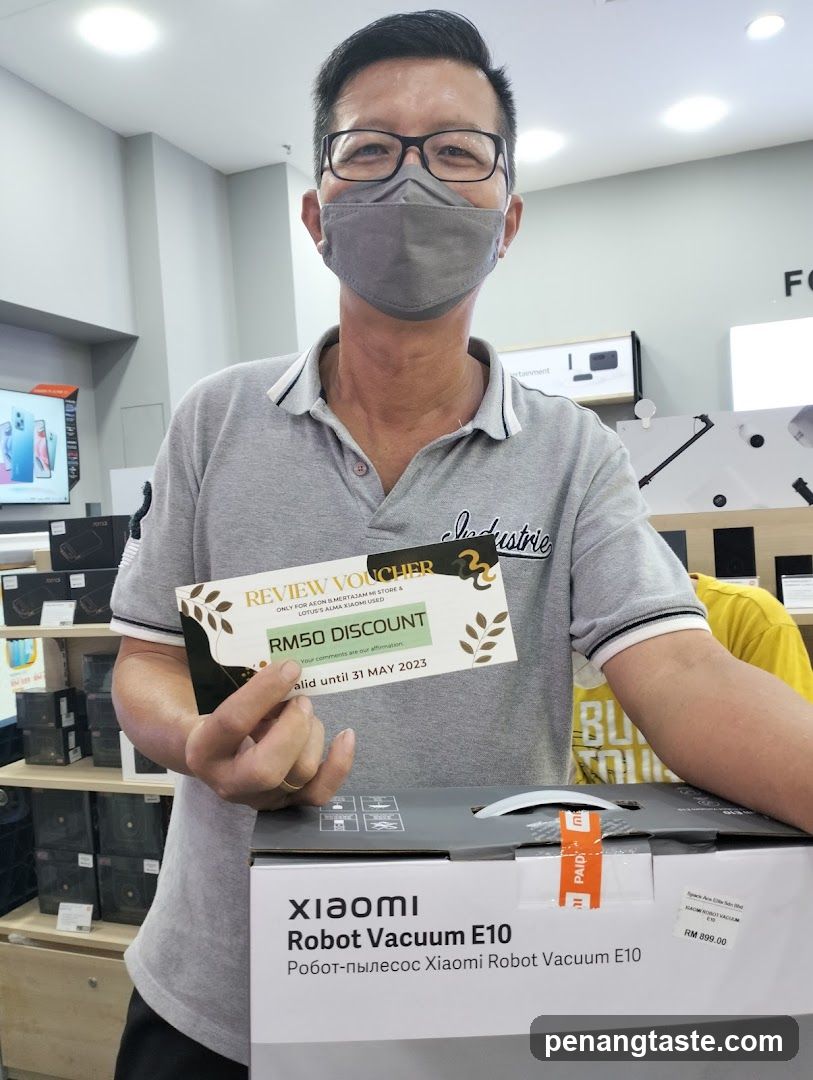 Customer holding discount voucher in electronics store