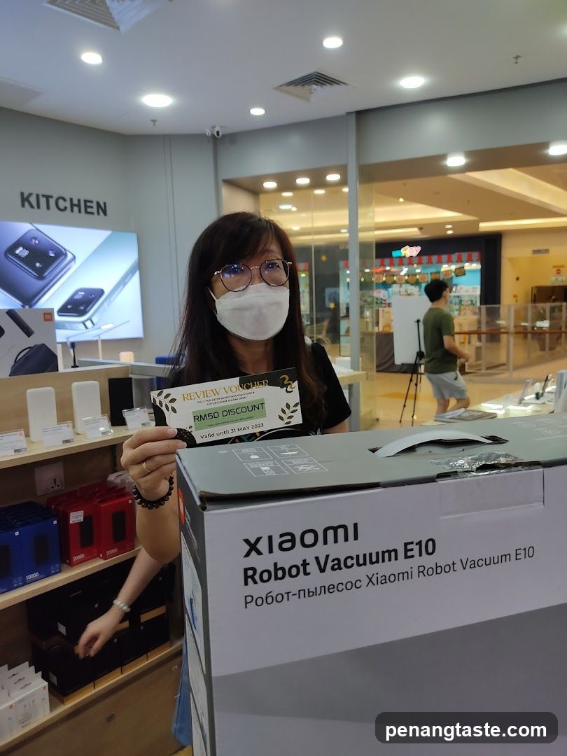 Customer holding discount voucher in electronics store