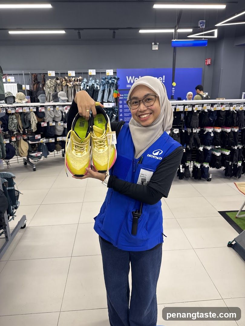 Store Staff Holding Shoes