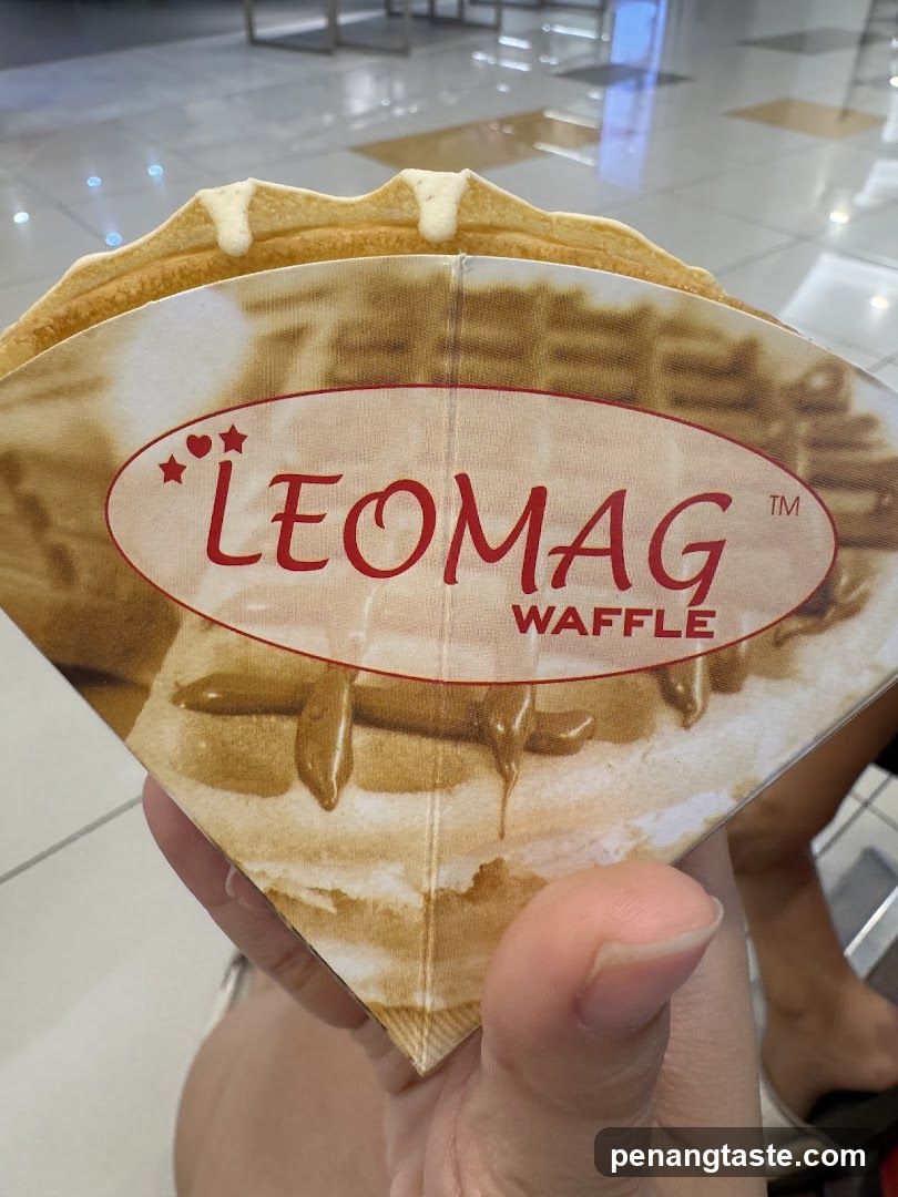 Hand holding LEOMAG Waffle packaging