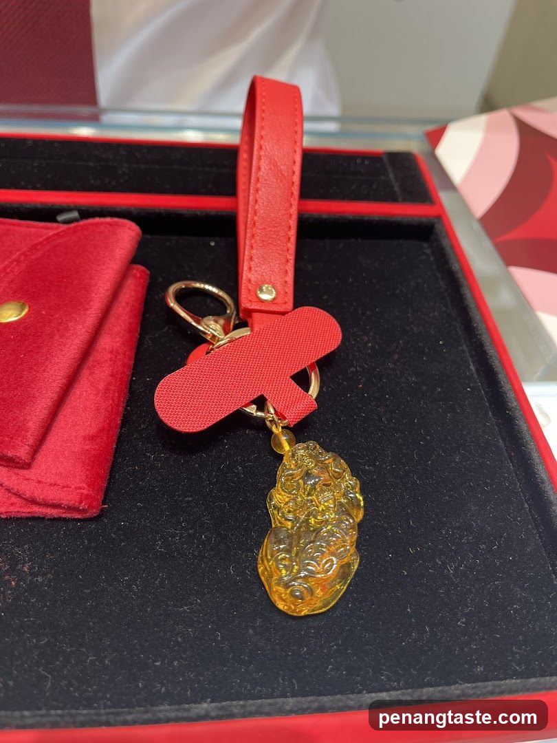 Red Keychain with Gold Charm in Box