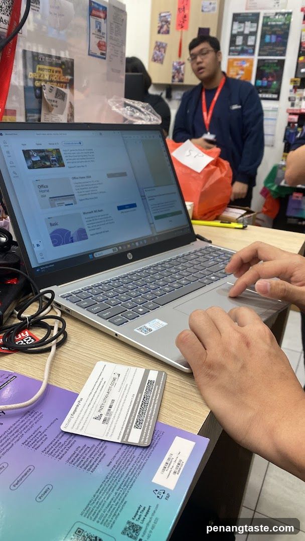 Customer at counter with laptop