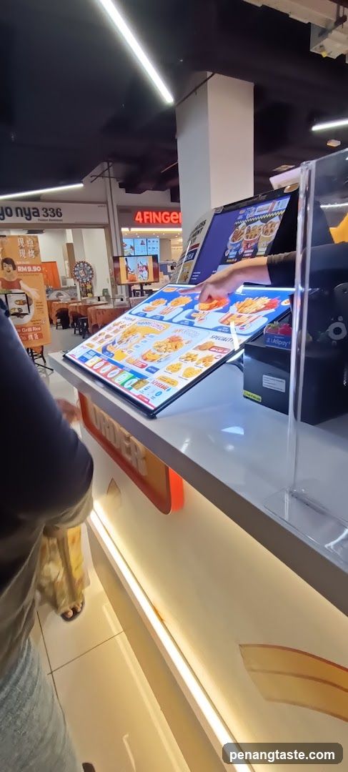 Customer ordering at food counter