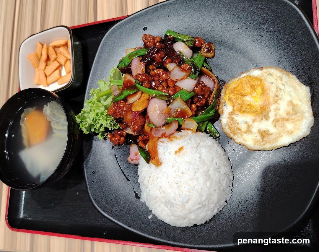 Meal served on black plate