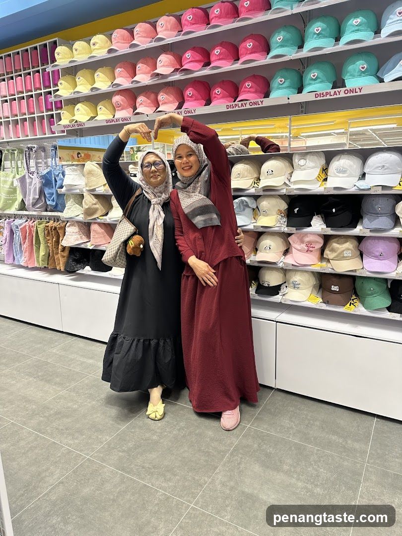 Two women posing in a retail store
