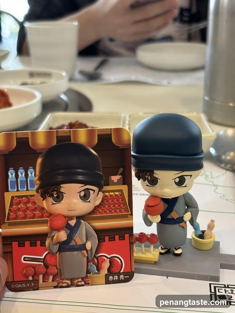 Tabletop figurines and printed card at dining table