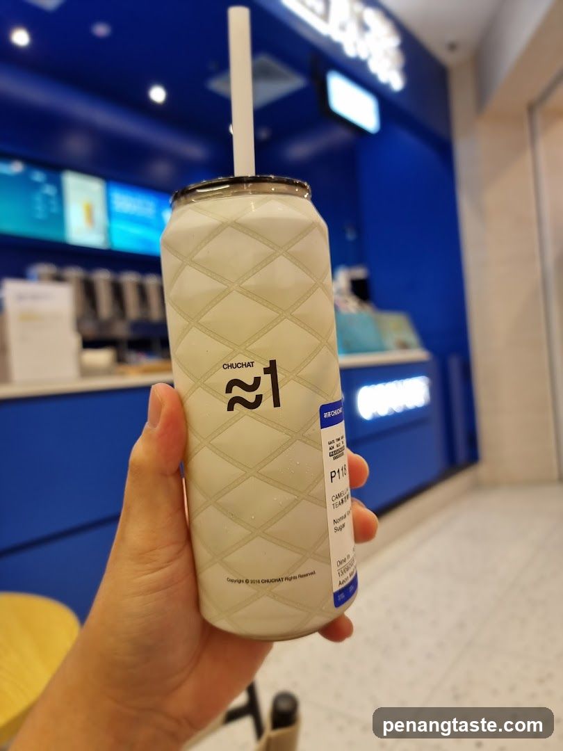 Hand holding beverage can