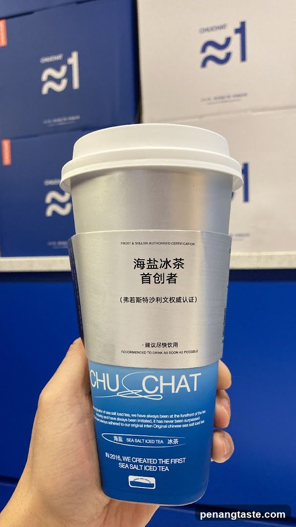 Hand holding a beverage cup