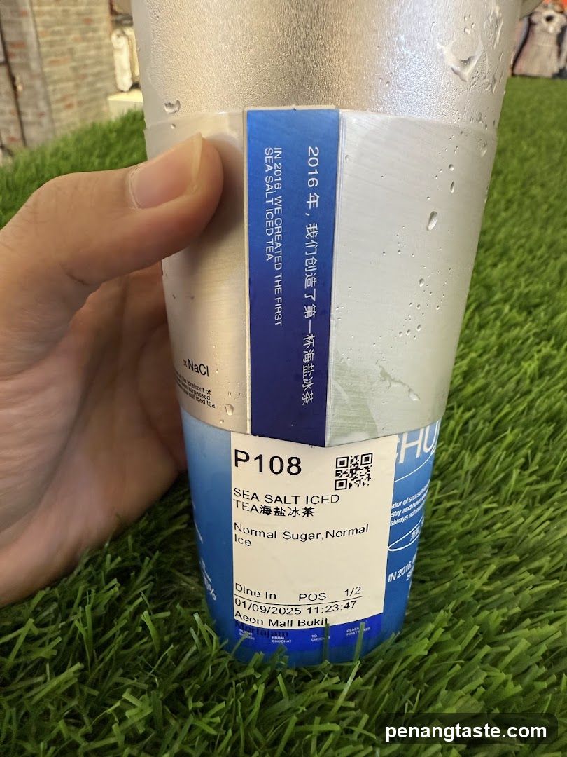 Hand holding a beverage cup
