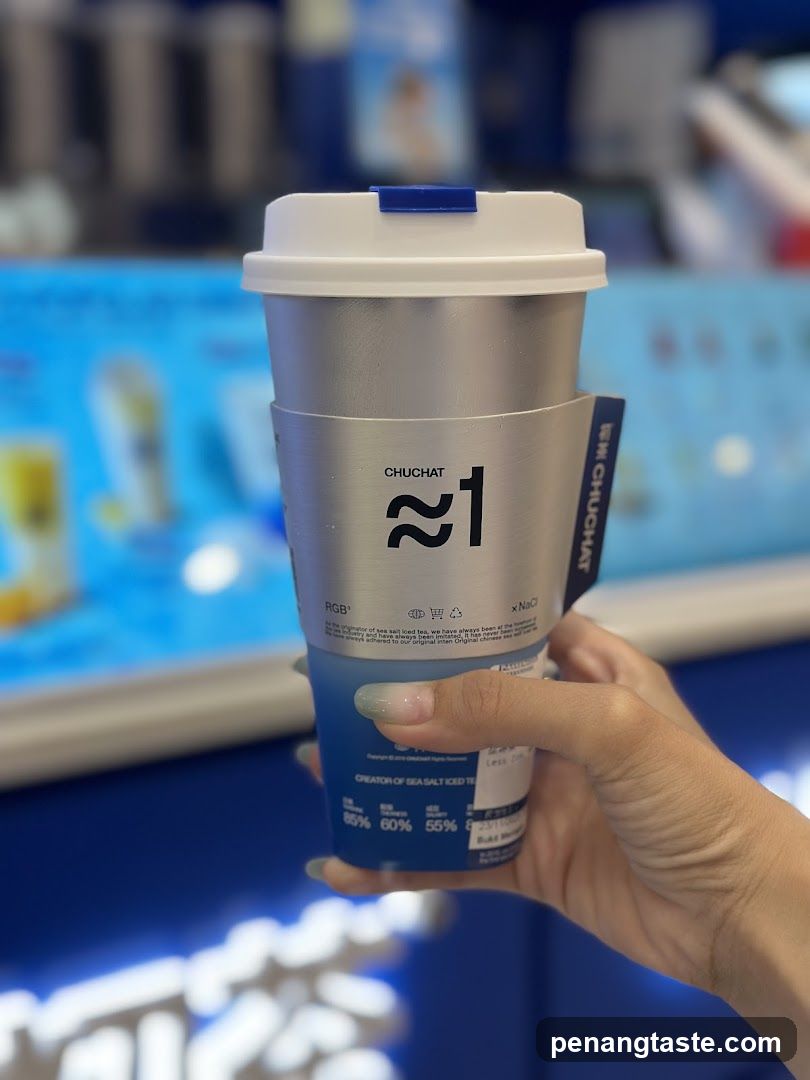Hand holding a beverage cup