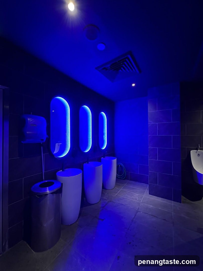 Blue-lit restroom interior