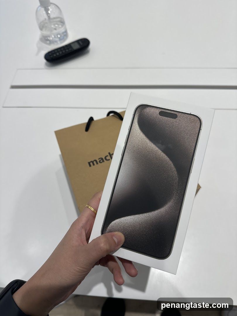 Hand holding smartphone box