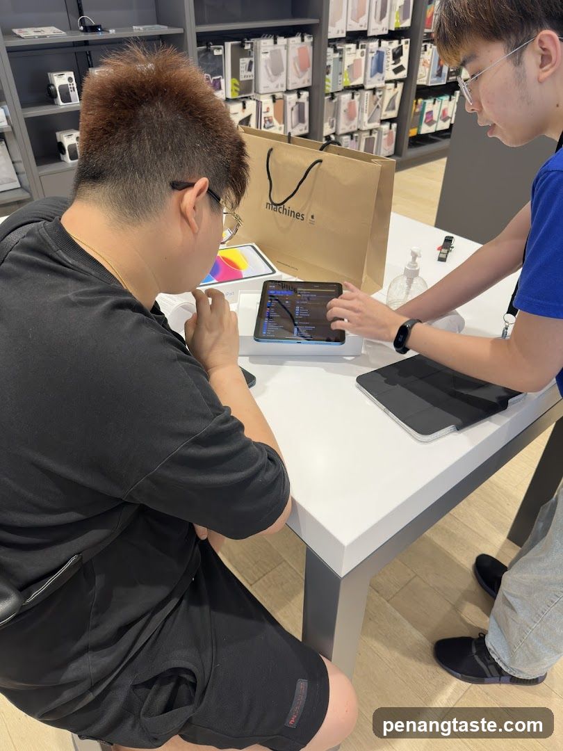 Customer and staff in electronics store