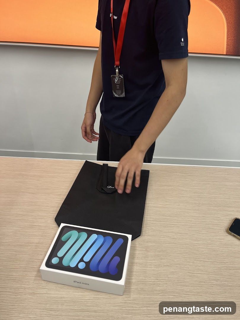 Staff with iPad mini box