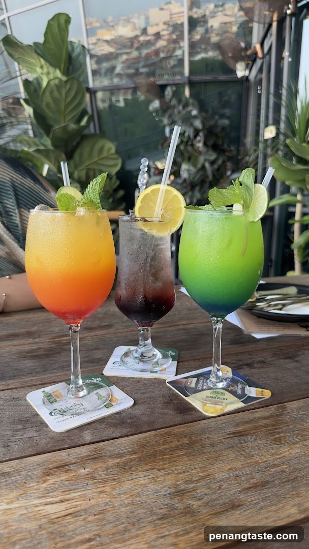 Cocktails on wooden table with city view