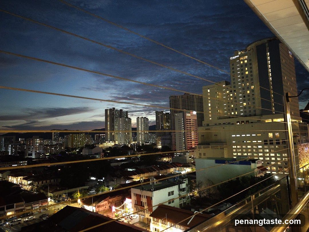 Cityscape at dusk viewed from balcony